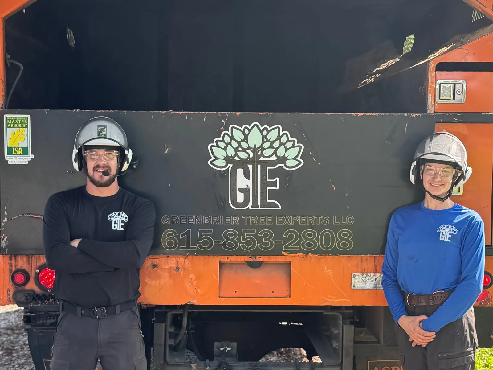 Gabe and Lauren in front of back of truck